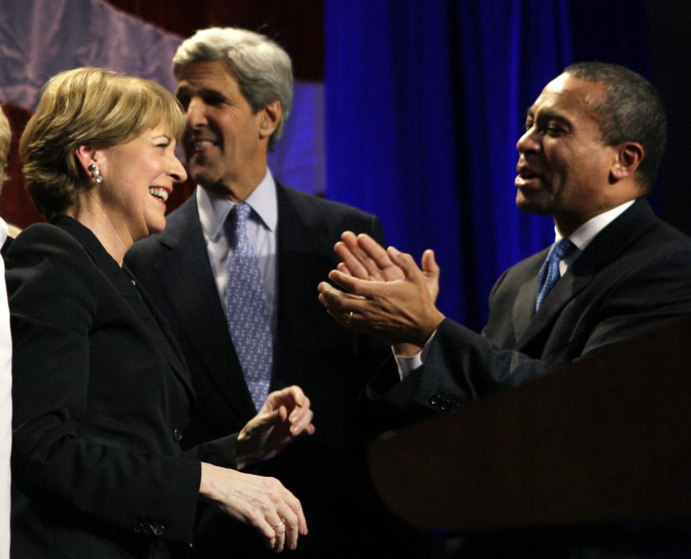 Martha Coakley is applauded by Gov. Deval Patrick and Sen. John Kerry during her primary election night victory event in Boston on Tuesday. (AP) 