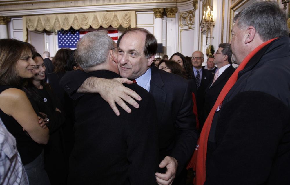 Rep. Michael Capuano embraces a supporter after learning he had lost to Coakley. (AP)