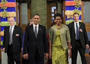 Nobel Peace Prize laureate President Obama enters the Nobel Peace Prize ceremony with first lady Michelle Obama at City Hall in Oslo. (John McConnico/AP)