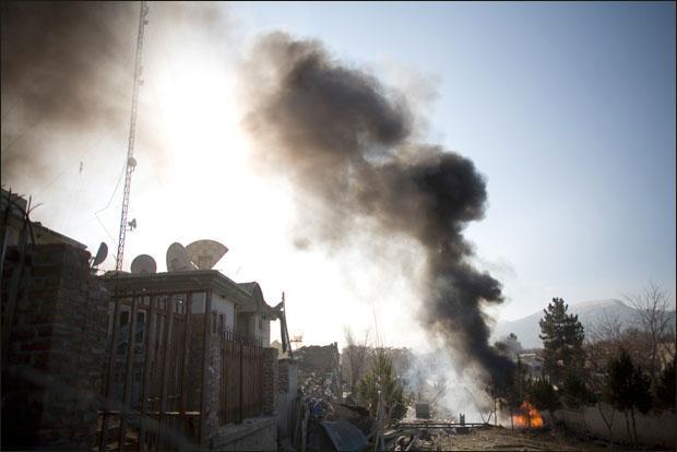 A car bomb burns near a building in Kabul, Afghanistan. (AP)