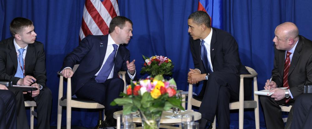 With translators on either side, President Barack Obama and Russian President Dmitry Medvedev talk during a meeting at the United Nations Climate Change Conference at the Bella Center in Copenhagen, Denmark, Friday, Dec. 18, 2009. (AP)