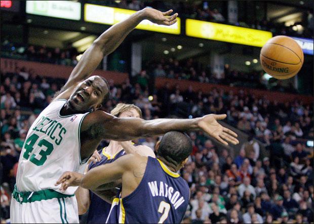 Boston Celtics center Kendrick Perkins can&#039;t reach an offensive rebound against Indiana Pacers forward Troy Murphy, center, and guard Earl Watson on Tuesday. (AP)