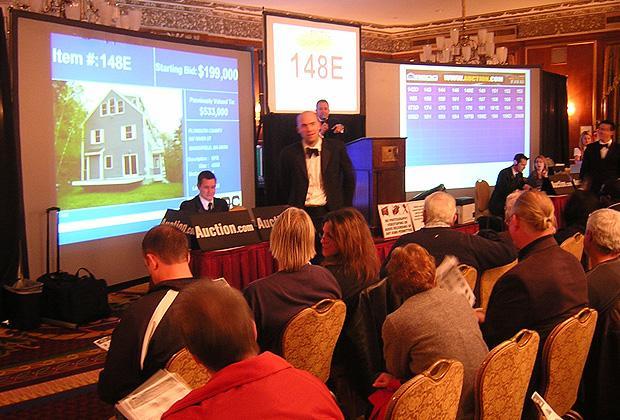 Participants prepare to bid at a recent foreclosure auction at the Boston Park Plaza Hotel.  (Sean Cole/WBUR)