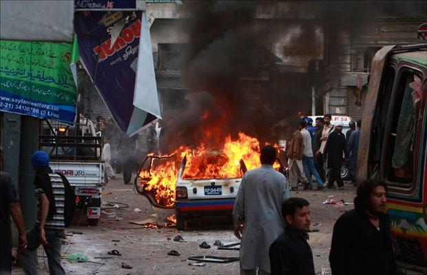 A vehicle is on fire after a bomb blast struck a Shiite Muslim procession in Karachi, Pakistan. (AP)