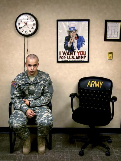 IAN FISHER: AMERICAN SOLDIER - In the army now. Ian Fisher cradles his injured elbow during his processing into the Army in June 2007. Though he later had a change of heart after speaking with a commander, he saw a possibility to escape his enlistment only two days in. From his first day in fatigues through his days driving a Humvee in Iraq, military life often didn't mesh with his expectations. Sometimes the structure of the Army and the demands of training for war clashed with the freedom he shared with his outside friends, but over two years, he overcame injuries and obstacles from both the Army and himself.  Adapting to the military pushes young recruit to his limits.  His decision to join the Army grew out of many things. The opportunity to fight for his country. The desire to add to a family legacy. The need to point his young life in a productive direction. In the spring of 2007 and at the depths of the Iraq warÕs unpopularity, Ian Fisher graduated from LakewoodÕs Bear Creek High School and, two weeks later, shipped out to basic training. There, he began the challenging process of becoming an American soldierÑand outgrowing the trappings of youth. Like many recruits, he would struggle, learn, make mistakes and rebound. His training prepared him for violent conflict in a foreign land. Nothing prepared him for the war within. (Craig Walker for the Denver Post)