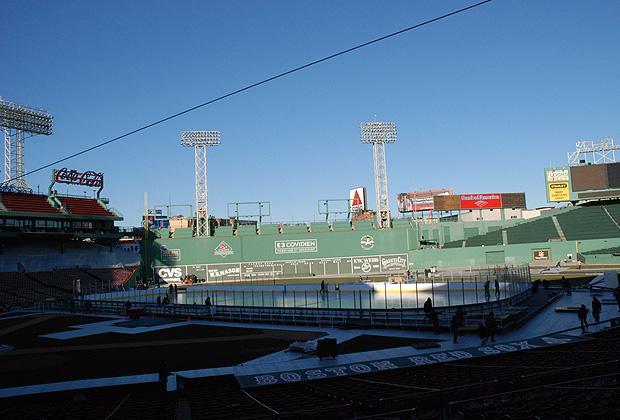 Under the looming Green Monster, the newly-constructed ice rink at Fenway Park awaits the NHL's 2010 Winter Classic.  (Sarah Bush/WBUR)