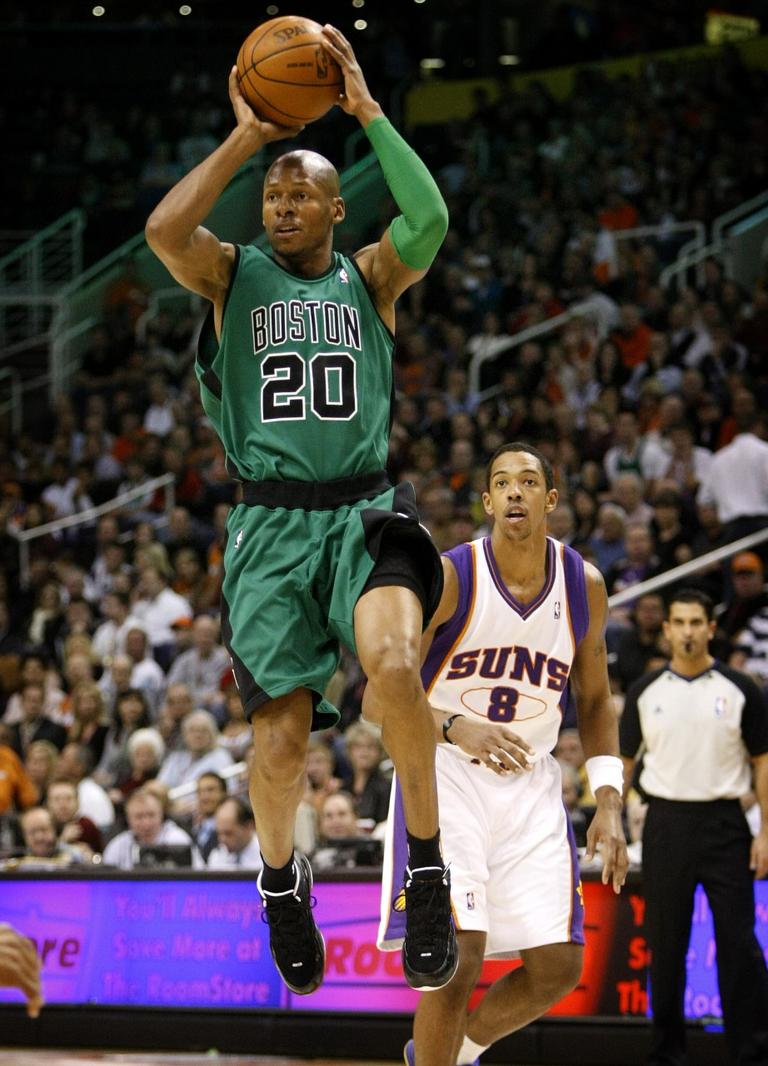 Boston Celtics&#039; Ray Allen (20) looks to pass as Phoenix Suns&#039; Channing Frye (8) looks on during the first half of an NBA basketball game Wednesday, Dec. 30, 2009, in Phoenix. (AP Photo/Matt York)