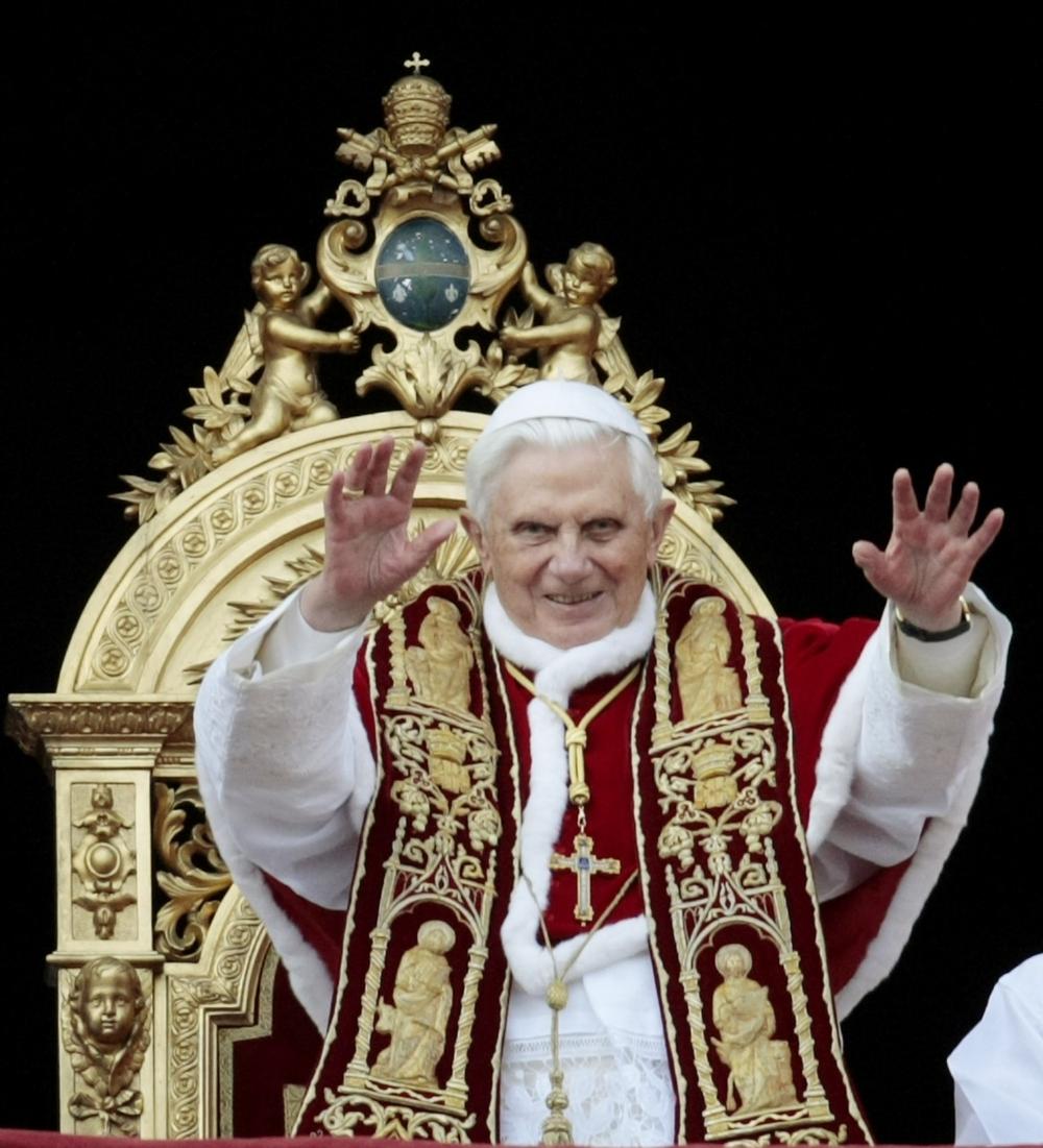 Pope Benedict XVI waves to faithful during the &quot;Urbi et Orbi&quot; (to the City and to the World) message in St. Peter's square at the Vatican, Friday, Dec. 25, 2009. (AP)