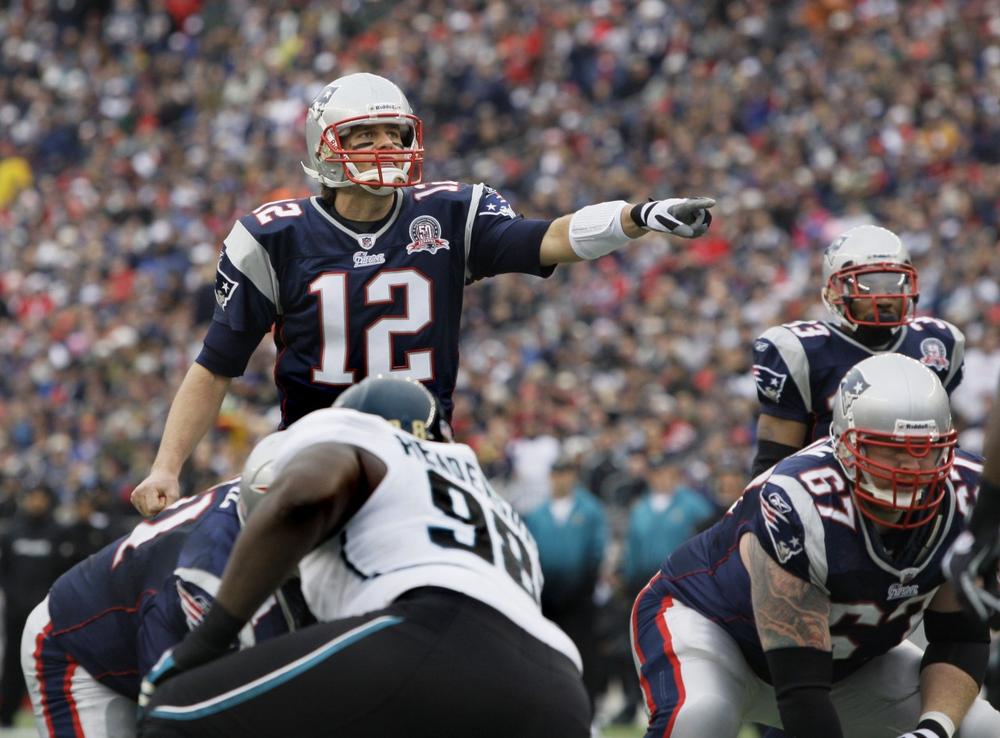 New England Patriots quarterback Tom Brady (12) directs his team against the Jacksonville Jaguars during an NFL football game in Foxborough, Mass. on Dec. 27.  The Patriots won to clinch the AFC East Division. (AP)