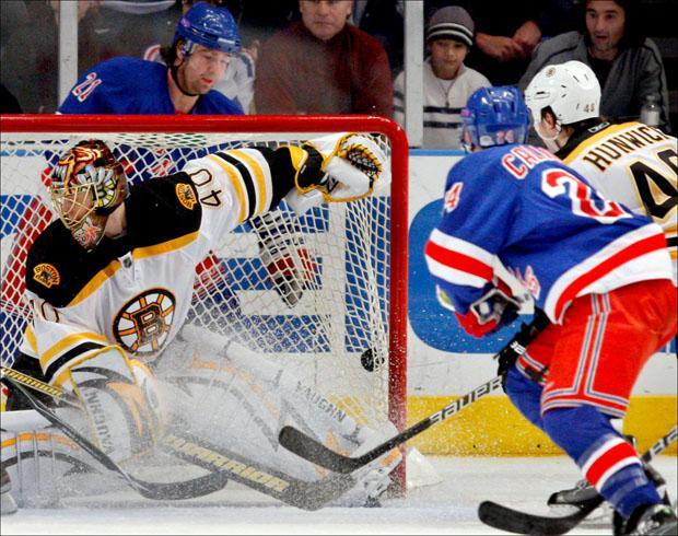 Rangers left wing Christopher Higgins watches as his third period goal evades Bruins goalie Tuukka Rask in the Rangers 3-2 victory over the Boston Bruins on Monday. (Kathy Willens/AP)