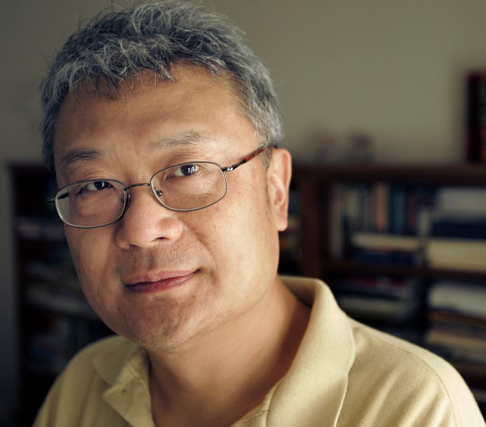 Writer Ha Jin poses in the study of his home in Foxborough, Mass., Monday, July 30, 2007. (AP)