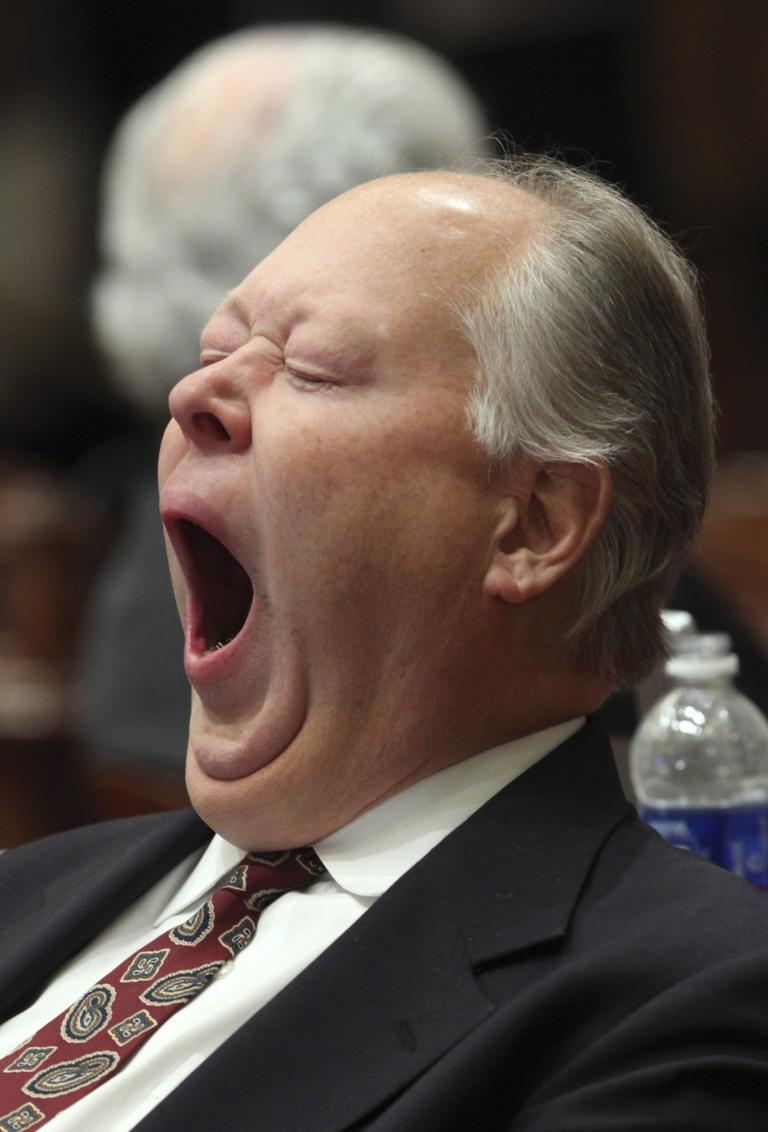 New research shows that long-term sleep loss builds up over time and can cause health problems. California State Sen. Sam Aanestad yawns at the Capitol in Sacramento. (AP) 