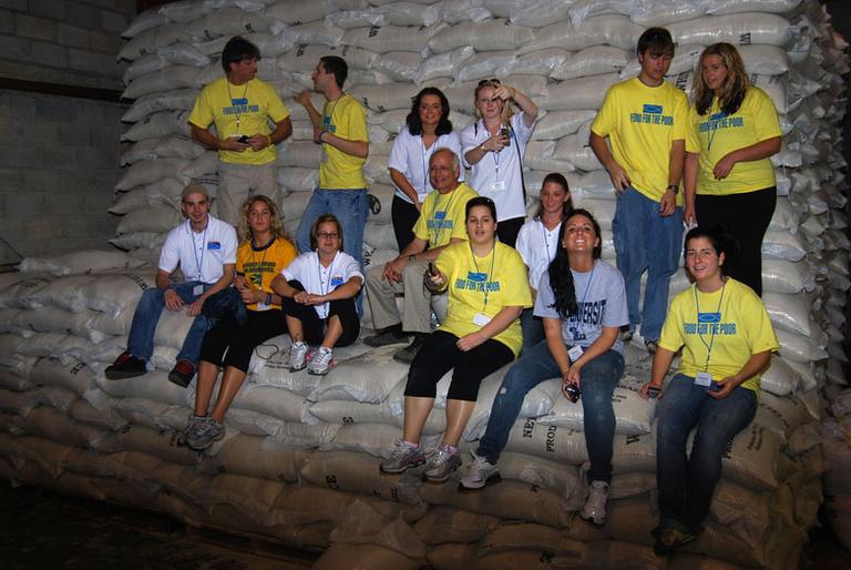 In this Jan. 11 photograph released by Lynn University, students with the “Journey for Hope” group from the school pose in Port-au-Prince, Haiti. Britney Gengel is seated second from right. She remains missing after the university received false word that she had been found alive. (Via AP)