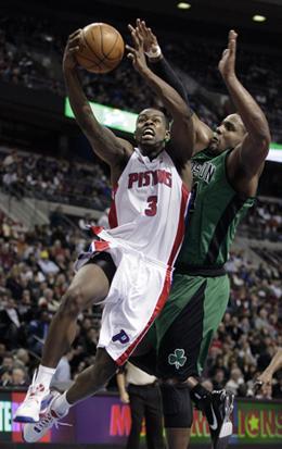 Detroit Pistons guard Rodney Stuckey (3) goes to the basket against Boston Celtics forward Glen Davis in the second half of Thursday&#039;s game. (AP Photo/Duane Burleson)
