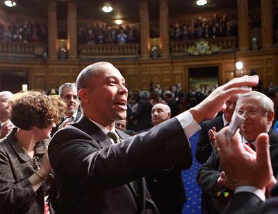 Gov. Deval Patrick waves as he enters the House Chamber at the State House on Thursday. (AP)