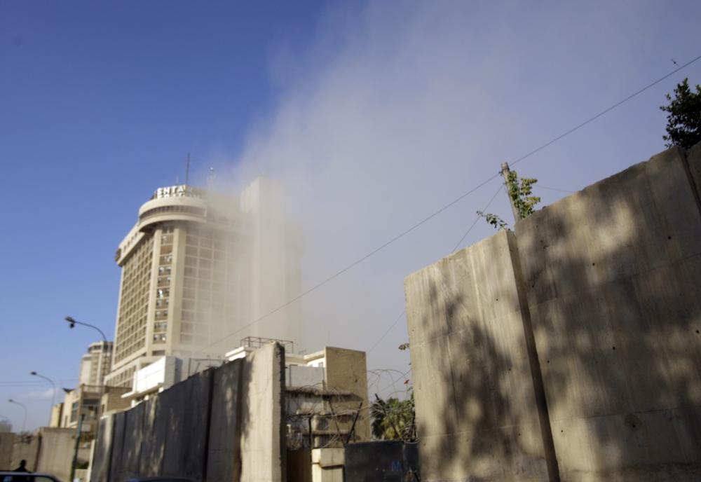 Smoke rises over the Sheraton Hotel in central Baghdad, Iraq, Monday, Jan. 25, 2010. Three parked car bombs struck near three Baghdad hotels popular with Western journalists and businessmen. (AP