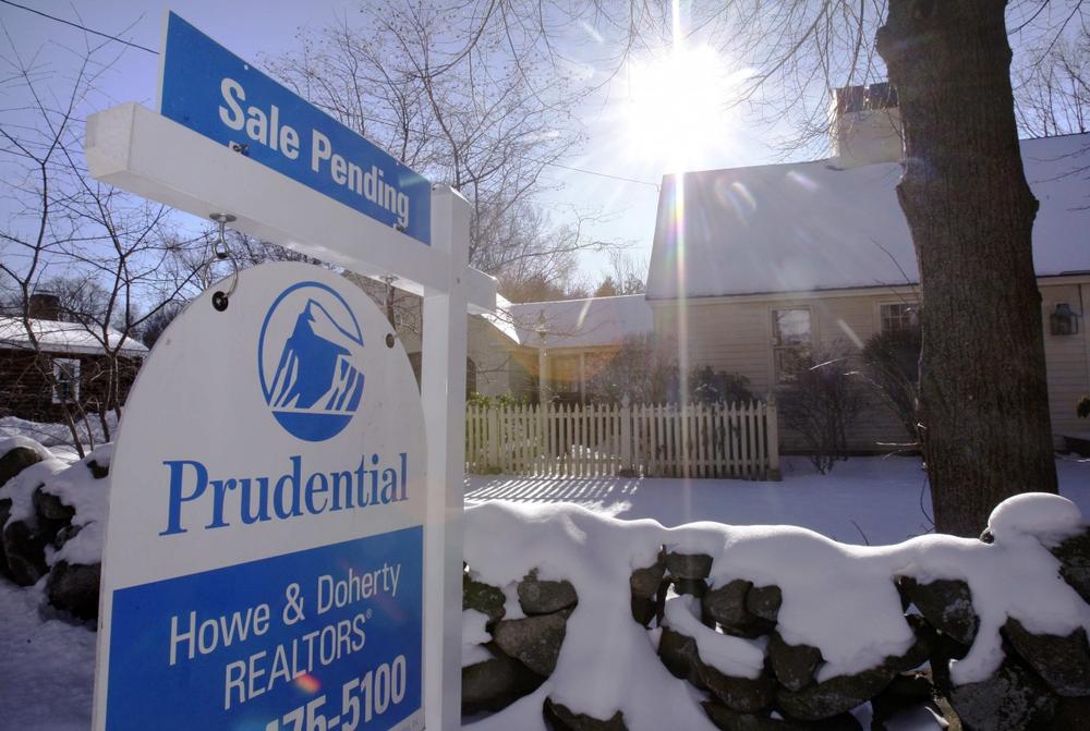 A sale pending sign is posted outside a home in Andover on Dec. 22, 2009. (AP)
