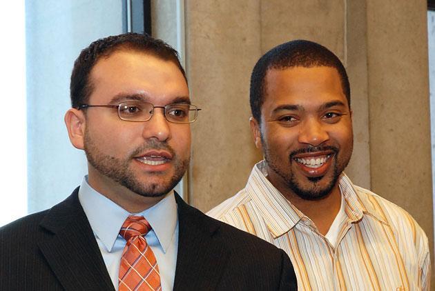 William Harvey Jr., right, with Boston City Councilor Felix Arroyo on Wednesday. (Jesse Costa/WBUR)
