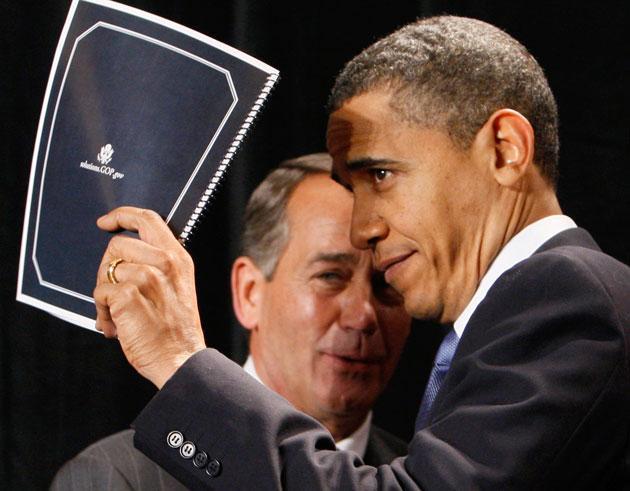 President Obama holds up a document of Republican solutions given to him by House Minority Leader John Boehner of Ohio, before addressing Republican lawmakers at the GOP House Issues Conference, in Baltimore, Friday. (Charles Dharapak/AP)