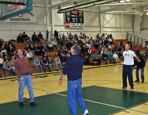 Dave Cummings, right, swishes another free throw during halftime of a high-school game at Pembroke Academy in Pembroke, N.H. on Jan. 20. Cummings made 20 shots that night to bring his total to 100,000. (Doug Tribou/WBUR)