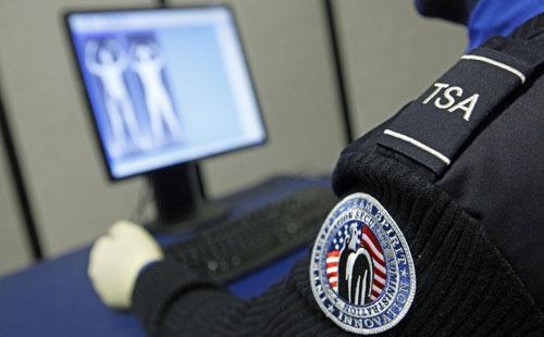A Transportation Security Administration officer views a full-body scan during a demonstration of passenger screening technology, Wednesday, Dec. 30, 2009, at the TSA Systems Integration Facility in Arlington, Va. (AP)