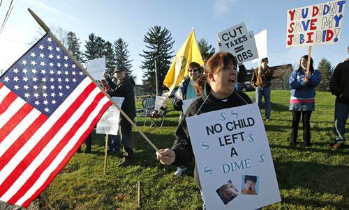 Tea Party Group member Sharon Bergstein of Allentown, Pa., and others, gather outside Lehigh Carbon Community College in Schnecksville, Pa., Friday, Dec. 4, 2009, where President Barack Obama is scheduled to make remarks. (AP)