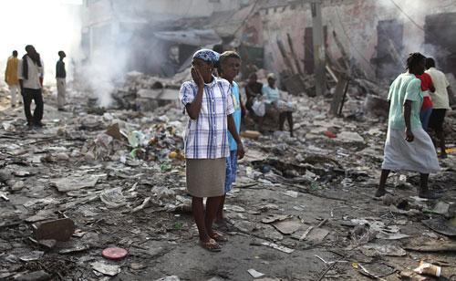 A woman gestures in the market area in Port-au-Prince on Monday, Jan. 18, 2010. (AP)