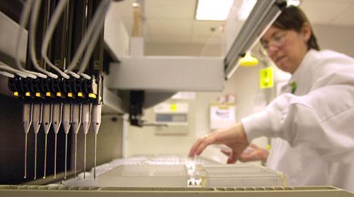 Patient samples are loaded into a machine for testing at Myriad Genetics in Salt Lake City. (AP)