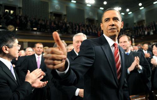 President Barack Obama walks down the center aisle greeting members of Congress on his way to deliver his State of the Union address on Capitol Hill in Washington, Jan. 27, 2010. (AP)