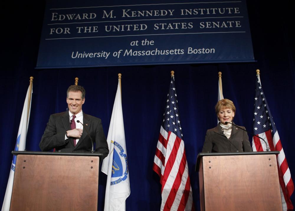 Candidates for the U.S. Senate seat, Republican Scott Brown and Democrat Martha Coakley, right, make last minute preparations before a debate on the campus of the University of Massachusetts, in Boston, Monday. (AP)