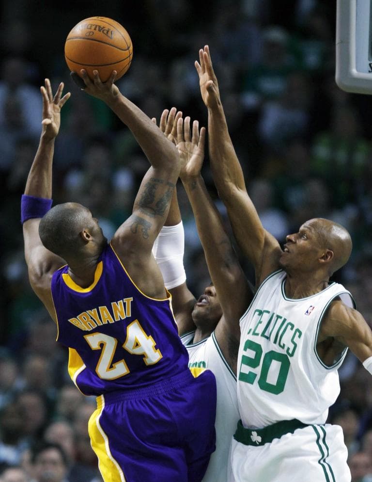 Los Angeles Lakers&#39; Kobe Bryant (24) shoots over Boston Celtics&#39; Ray Allen (20) and Glen Davis in the fourth quarter of Sunday&#39;s game. (AP Photo/Michael Dwyer)