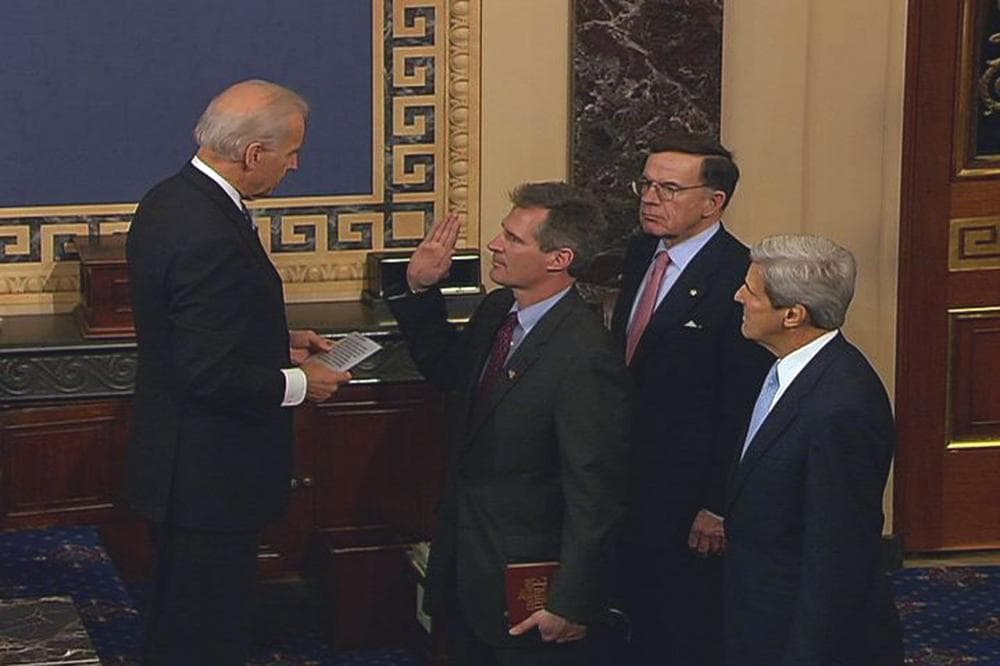 Vice President Joe Biden delivered the oath of office to Scott Brown at the Capitol on Thursday. Brown was flanked by former interim Sen. Paul Kirk and Sen. John Kerry, far right. (Senate Television via AP)