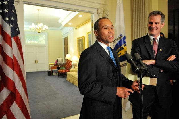 Gov. Deval Patrick, left, appeared with Sen. Scott Brown at the State House on Tuesday, shortly after signing and certifying his Senate victory. (Gretchen Ertl/AP)