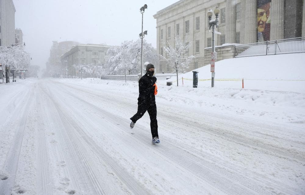 A runner takes a morning run during a snow storm in Washington, Saturday, Feb. 6. (AP Photo/Nick Wass)