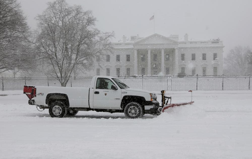 A snowplow clears the snow along Pennsylvania Ave., in front of the White House in Washington, Wednesday, Feb. 10, 2010. (AP)