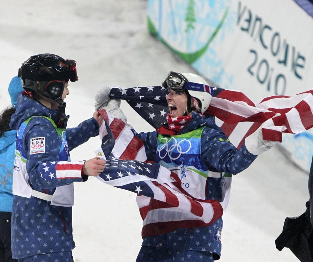 Hannah Kearney of the USA, Olympic champion in women's moguls is congratulated by third placed Shannon Bahrke of the USA at the Vancouver 2010 Olympics in Vancouver, British Columbia, Saturday. (AP Photo/Jae C. Hong)