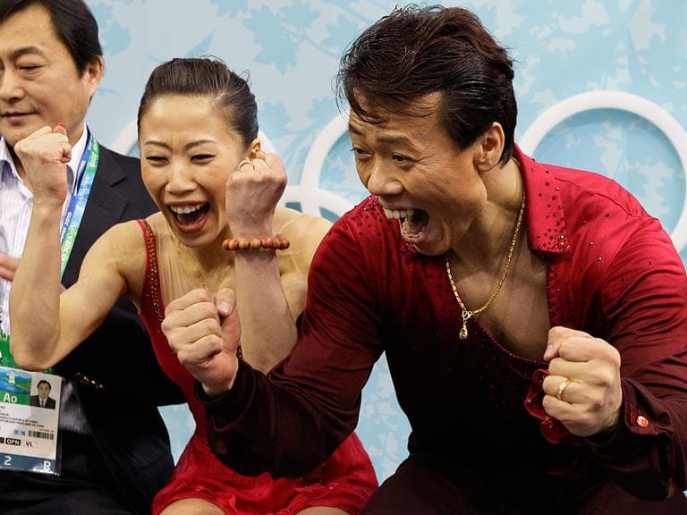 China's Shen Xue and Zhao Hongbo react after receiving the highest score, to win gold, for performing their pairs free program during the figure skating competition at the Vancouver 2010 Olympics in Vancouver, British Columbia. (AP)