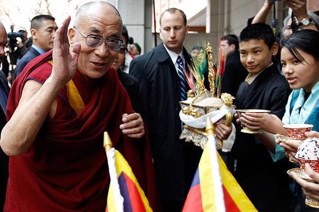 His Holiness the Dalai Lama waves as he arrives in Washington on Wednesday. (AP)