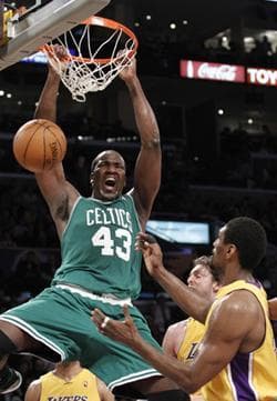 Boston Celtics center Kendrick Perkins (43) dunks over Los Angeles Lakers forward Ron Artest, right, during the second half of Thursday&#39;s game.(AP Photo/Lori Shepler)