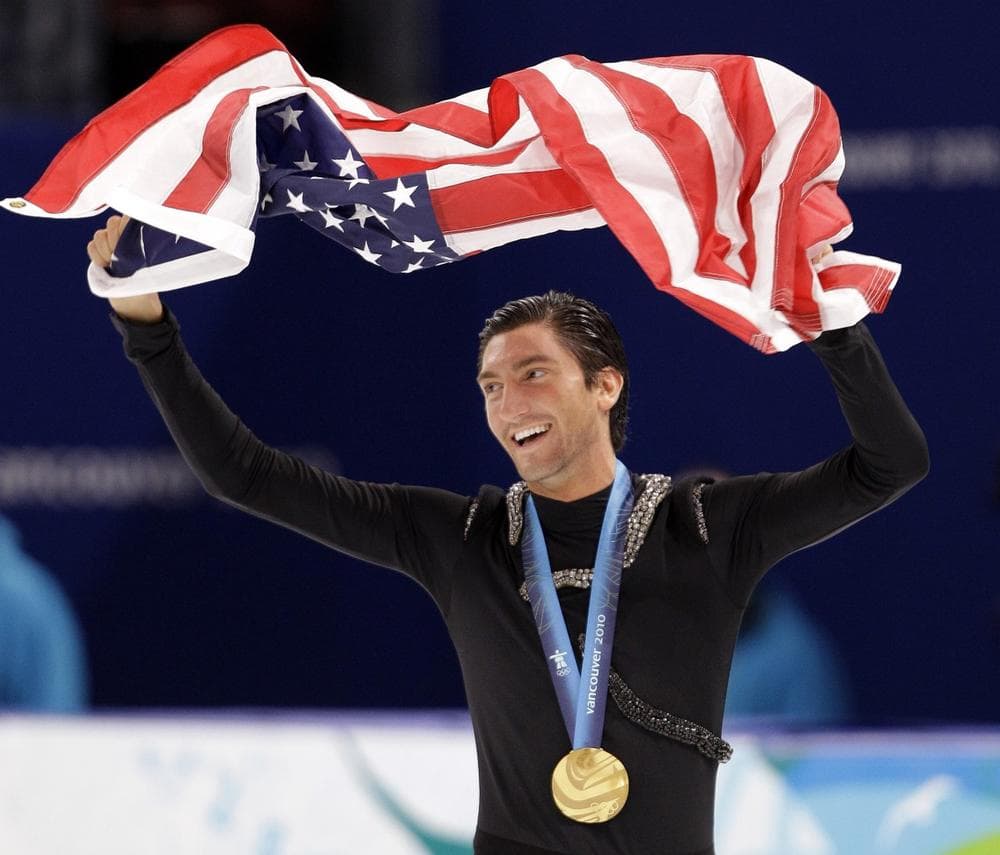 USA's Evan Lysacek waves the U.S. flag during the victory ceremony after winning the gold medal in the men's free program figure skating competition at the Vancouver 2010 Olympics in Vancouver, British Columbia, Thursday, Feb. 18, 2010. (AP Photo/David J. Phillip)