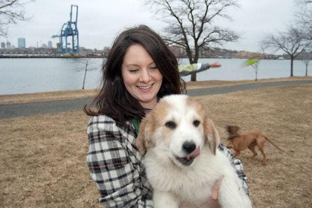 Every day, Chris Shoch walks her dogs at a park along the waterfront of Boston Harbor in Everett, a few hundred yards from a docked LNG tanker from Yemen. (Andrew Phelps/WBUR)