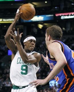 Boston Celtics&#39; Rajon Rondo (9) passes past New York Knicks&#39; David Lee in the third quarter of Tuesday&#39;s game. (AP Photo)