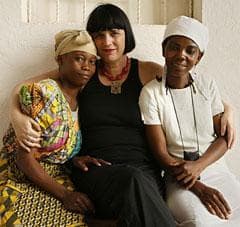 In this photo released by V-Day, Eve Ensler is joined by two women outside Panzi Hospital in Bukavu, eastern Congo. The hospital sees about 3,500 women a year suffering fistula and other severe genital injuries, victims of what a U.N. expert called the worst violence against women in the world. (AP)