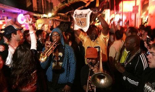 New Orleans Saints fans celebrate in the French Quarter in New Orleans after the Saints defeated the Indianapolis Colts in the Super Bowl on Sunday, Feb. 7, 2010. (AP) 