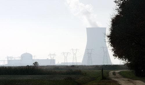 A large cooling tower and other buildings at the Salem nuclear power plant, known as Artificial Island, near a farm in Lower Alloways Creek Township, New Jersey, in 2007. (AP)