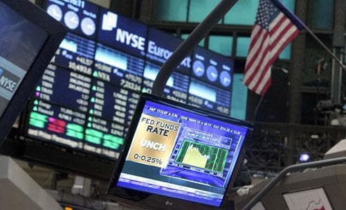 A television screen on the floor of the New York Stock Exchange on Dec. 16, 2009 showed the Federal Reserve&#039;s decision at that time to hold interest rates at a record low. It pledged to keep them there for an &quot;extended period.&quot; (AP)