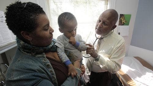 Dr. Michael Lenoir examines a young patient in his offices in Oakland , Calif., on Feb. 3, 2010. California has the greatest number of uninsured residents in the country and the largest public insurance program for the poor, which struggles to serve 6.5 million people while reimbursing doctors at one of the nation&#039;s lowest rates. (AP)
