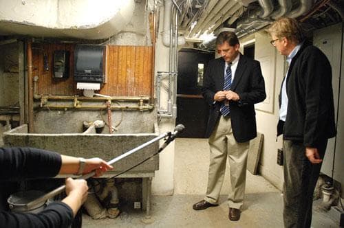 Anthony Amore, the director of security for the Gardner Museum, gives On Point host Tom Ashbrook a tour of the basement where guards were handcuffed by thieves on March 18, 1990. (Photo: WBUR)
