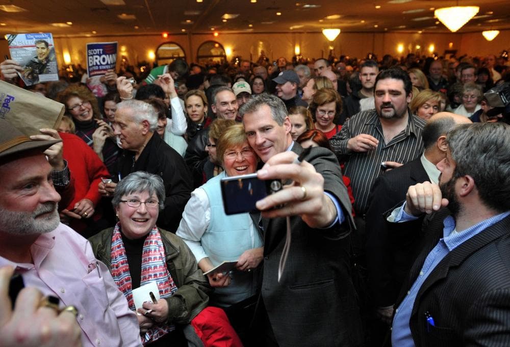 Sen.-elect Scott Brown takes a photo with Sandra Curtiss, of Chatham, as he greets supporters in Foxborough at the final stop of his three-day &quot;thank you&quot;  tour across the state. (AP)