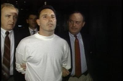 Vincent &quot;The Animal&quot; Ferrara is arrested in 1989 on racketeering and related charges. At right is Boston Police Det. Martin Coleman, now retired, who worked alongside Assistant U.S. Attorney Jeffrey Auerhahn on the Organized Crime Strike Force in the 1980s. (David Boeri)